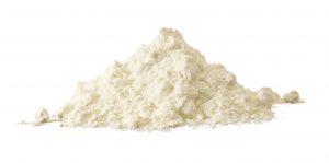 Heap of white powder isolated on white.